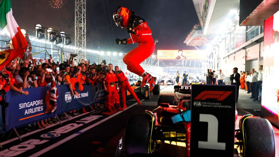 Carlos Sainz jumps off his Ferrari after Grand Prix victory
