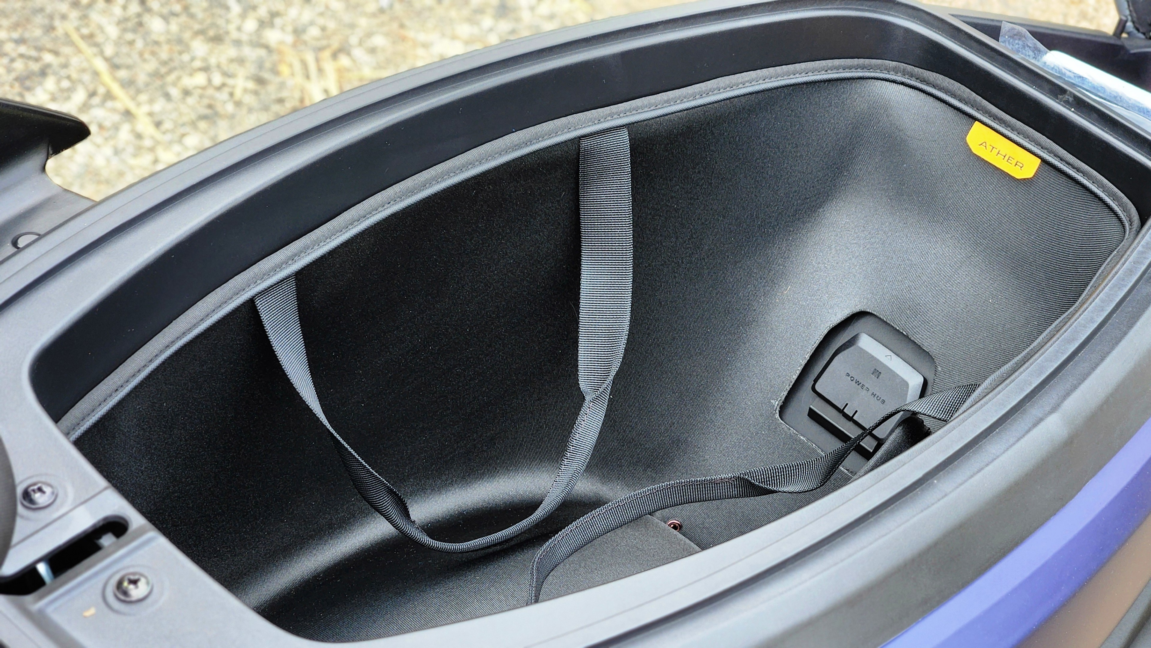 The under-seat storage at 34 litres is the same as the Ola S1 Pro but the Rizta can accommodate a full-size helmet with some room to spare. There is a smaller space to keep your phone, a first-aid kit and more as well Ather Rizta Review