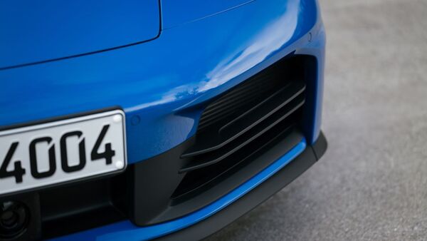 The 911 Carrera uses a 3.0-litre boxer engine with twin turbochargers. It puts out 392 bhp of max power and a peak torque output of 450 Nm. The new 911 Carrera Coupé goes from 0 to 100 km/h in 4.1 seconds. It can be further dropped to 3.9 seconds with the help of the Sport Chrono package. The top speed is rated at 294 kmph. The 911 Carrera uses a 3.0-litre boxer engine with twin turbochargers. It puts out 392 bhp of max power and a peak torque output of 450 Nm. The new 911 Carrera Coupé goes from 0 to 100 km/h in 4.1 seconds. It can be further dropped to 3.9 seconds with the help of the Sport Chrono package. The top speed is rated at 294 kmph.
