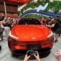 File photo: People look at the newly unveiled Onvo L60 SUV, the first vehicle from a lower-priced brand of Chinese electric vehicle maker Nio. (REUTERS)