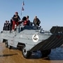 A DUKW amphibious truck drives across the beach in Arromanches-les-Bains, northwestern France as part of D-Day commemorations marking the 80th anniversary of the World War II Allied landings in Normandy. (AFP)