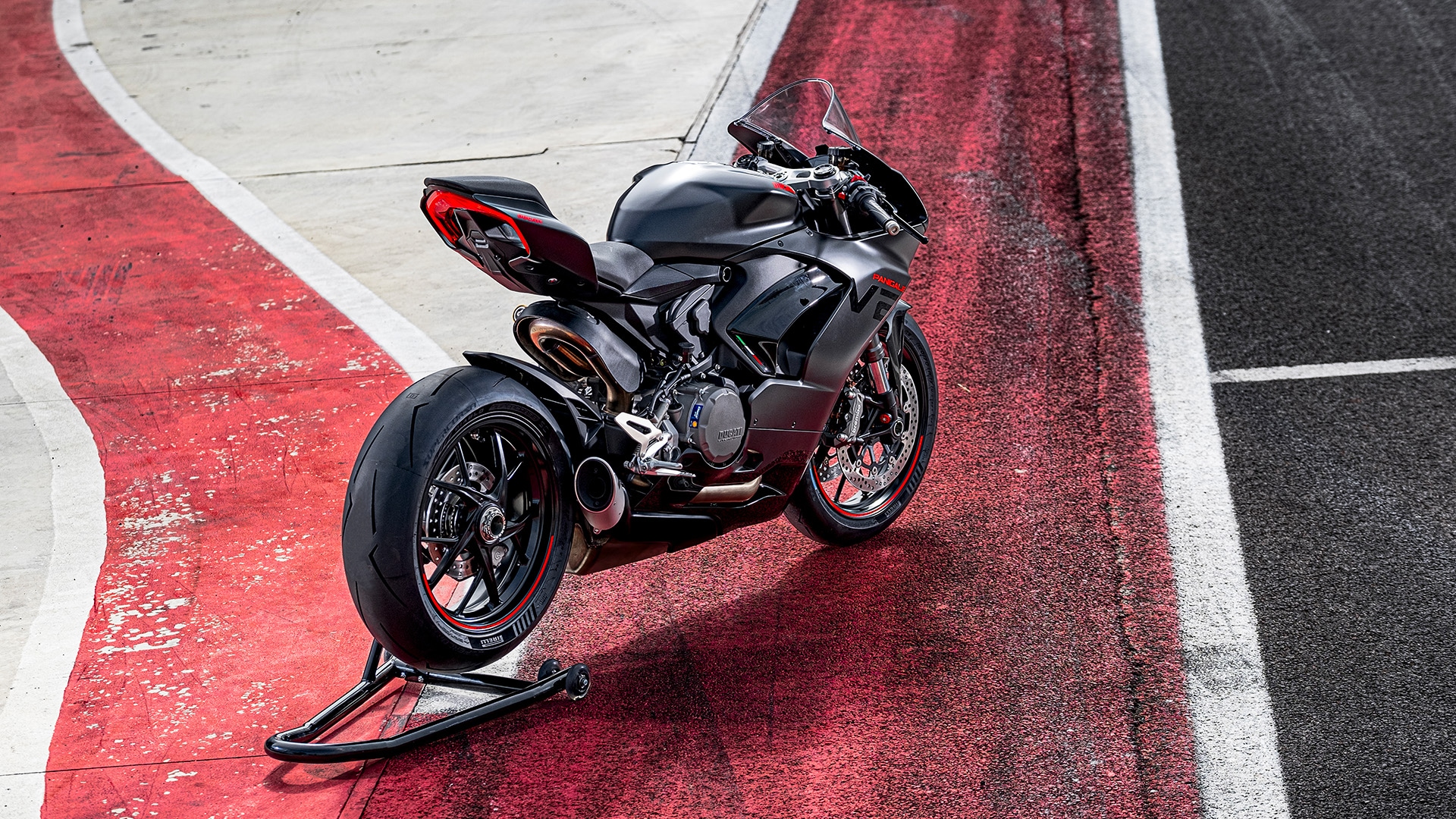 The all-black paint scheme is complemented by contrast red stickering on the fuel tank and fairing with a red pinstripe on the alloy wheels