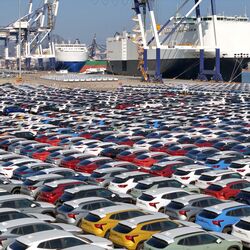 File photo: Cars to be exported sit at a terminal in the port of Yantai, Shandong province, China.