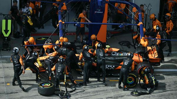McLaren driver Lando Norris stands in the pit after clashing with Red Bull racer Max Verstappen during the Formula One Austrian Grand Prix. F1