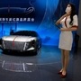 A promoter stands near a concept car for Chinese luxury auto brand Hongqi. which is China’s oldest automotive manufacturer. (AP)