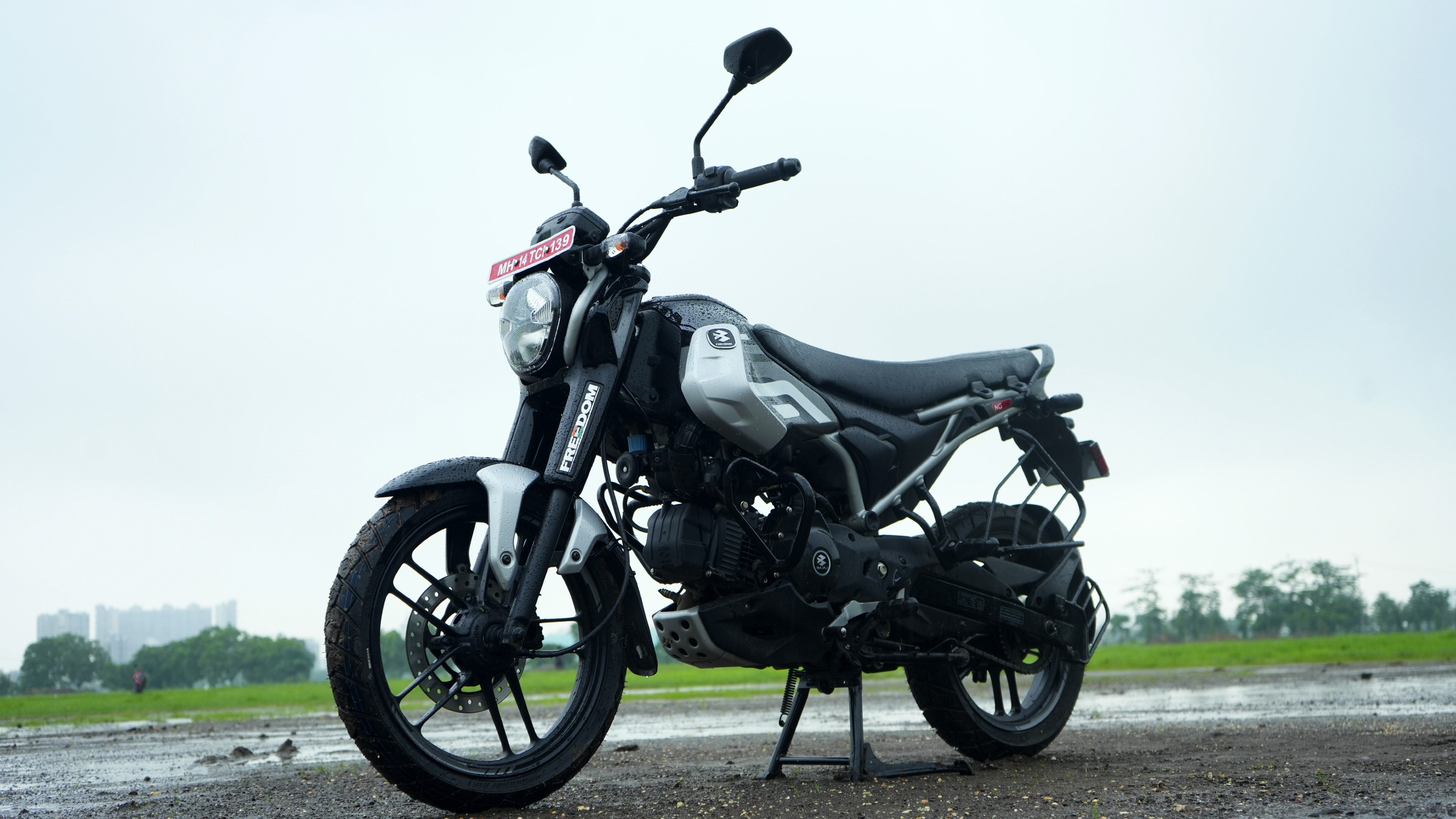 The styling appears to be inspired from supermoto motorcycles with the 17-inch front and 16-inch rear wheel setup with the rally-style seat further adding to the inspiration Bajaj Freedom 125 CNG Review