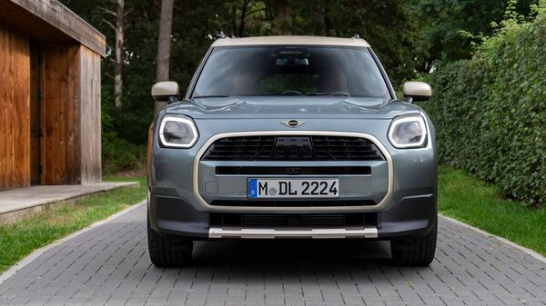 The front grille is larger, the headlights redesigned, and the rear tail lamps retain their signature triangular shape. The Mini Cooper S features distinctive Union Jack-inspired taillights, adding a touch of British flair. 