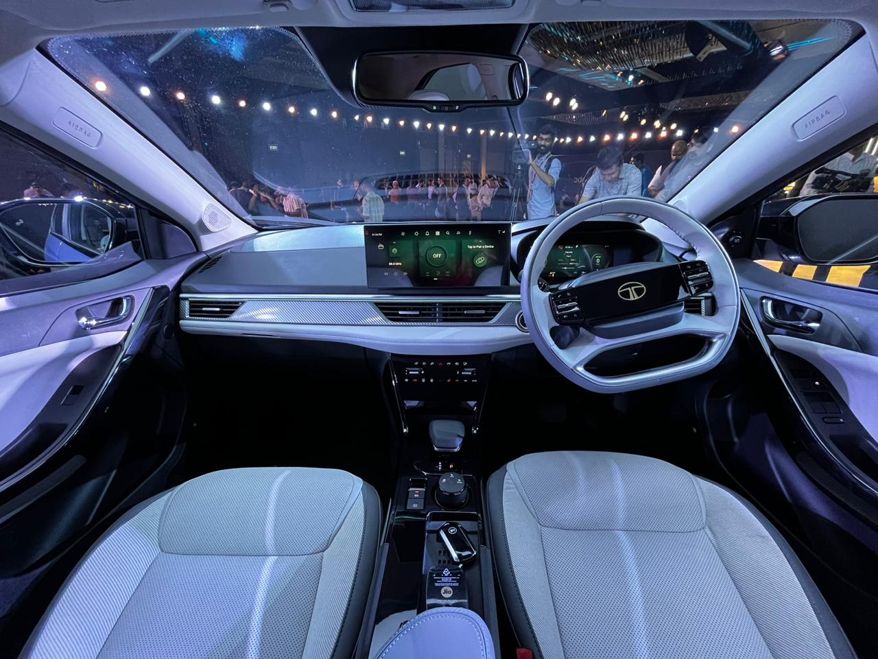 Just like its sibling Nexon EV, the Curvv EV sports a multifunction steering wheel that features an illuminated brand logo at the centre. Tata Curvv EV