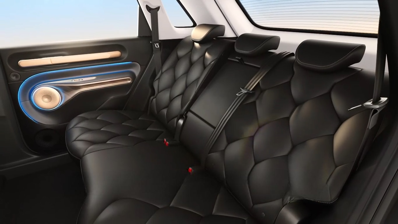 The teaser reveals the black and champagne-gold themed cabin with leatherette upholstery, rear AC vents and a rear armrest