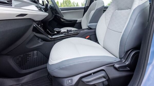 Both front seats inside the Curvv EV get cooling function but while there is electronic adjustment for the driver, the front passenger has to operate the seat using a set of conventional levers. Tata Curvv EV