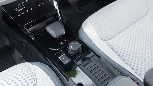 The wireless charging pad on the center console is great but replaces cup holders that usually find a place here. The center console itself is done in gloss black that looks very premium but only as long as you can maintain it against dust and fingerprints. Tata Curvv EV