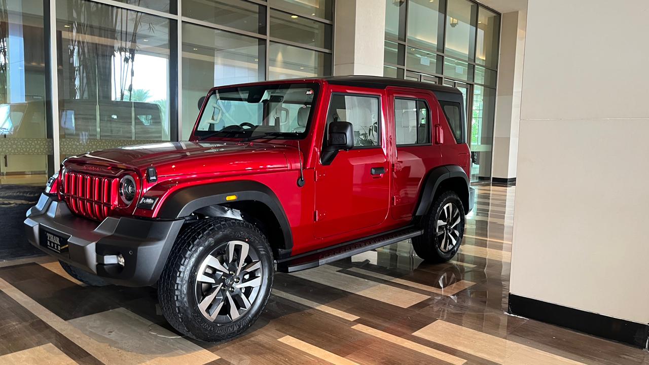 Mahindra Thar Roxx SUV poses a commanding road presence over its three-door sibling thanks to its larger size and muscular look.