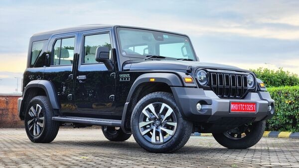 Mahindra Thar Roxx has grown in dimensions from all sides, compared to the Mahindra Thar. It is now well over 4 meters in length, allowing for a longer wheelbase and hence the addition of the two doors for back-seat passengers. The Roxx also gets an all-new alloy design on the 19-inch wheels.