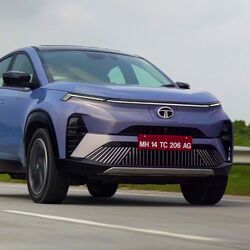 Tata Curvv EV has been launched at a starting price of ₹17.49 lakh (ex-showroom). The electric SUV offers up to 585 kms of range in a single charge. Tata claims the real world range of the electric SUV could be around 425 kms. The EV is equipped with two set of battery packs including a 45kWh unit and a 55kWh unit. It comes packed with features like level-2 ADAS, panoramic sunroof, ventilated seats and more. It takes on MG ZS EV among compact electric SUVs in India.