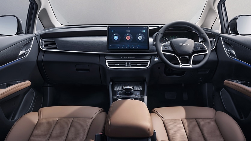 The cabin layout remains largely the same but there's a new steering wheel, a larger touchscreen and revised upholstery 2024 BYD M6