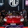 People visit the booth of Chinese automobile manufacturer MG's electric vehicle Cyberster during the Gaikindo Indonesia International Auto Show 2024 (Image used only for representational purpose) (AFP)