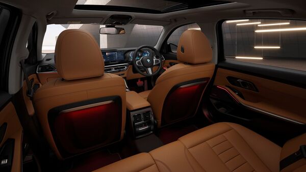 The front row seats get electrically adjustable Comfort Seats wrapped in genuine leather. BMW has further fitted in illuminated door sill plates and has enhanced ambient lighting through illuminated contour strips on the back of the front seats.