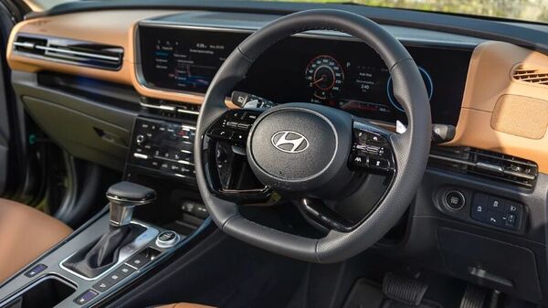 A closer look at the steering wheel and dashboard layout inside the latest Hyundai Alcazar.