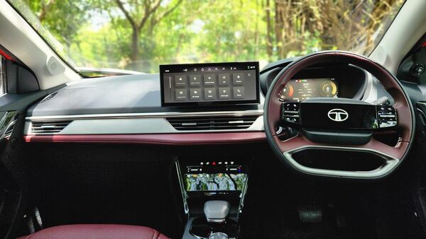 The free-standing infotainment screen grabs the centerstage on the dashboard. Notice though that the default steering position is slightly crooked.