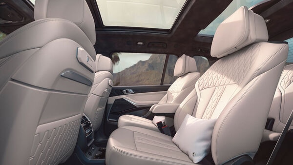 The second row gets captain seats wrapped in BMW Individual ‘Merino’ leather in Tartufo and Ivory White shade. The rear seats also get cushions wrapped in Alcantara leather. The X7 Signature also gets a 16-speaker Harman Kardon sound system and a slew of other features and connectivity options.