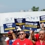 The United Auto Workers is seeking authorisation votes to green light a strike against Stellantis. Union president Shawn Fain said that UAW is looking to pressure the company into abiding by its contract and investment promises. | FILE PHOTO: Image of UAW members participating in an earlier rally against Stellantis in August (Bloomberg)