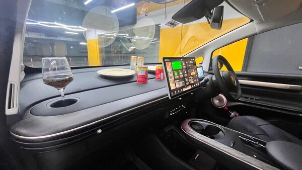 The massive dashboard area inside the Windsor EV can be a picnic table on the move. Turn on Netflix on this giant screen and it can be a date night in an EV!