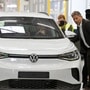 Germany Economy Minister Robert Habeck poses next to the a Volkswagen car at the company's facility  (Reuters)