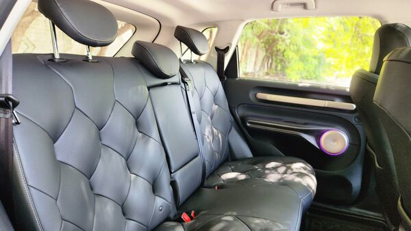 The plush rear seats are the best spot inside the Windsor EV. The cuhioning is absolutely phenomenal and a flat floorbed ensures enough space for three passengers. The car is also helped by a massive wheelbase that opens up a whole lot of legroom. The plush rear seats are the best spot inside the Windsor EV. The cuhioning is absolutely phenomenal and a flat floorbed ensures enough space for three passengers. The car is also helped by a massive wheelbase that opens up a whole lot of legroom.