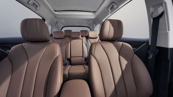 The three row MPV gets ventilated leatherette seats, a panoramic sunroof, roof-mounted AC vents and a NFC key card a powered tailgate. The one in this image is the seven seater variant, the six seater swaps out the second row bench with captain seats.