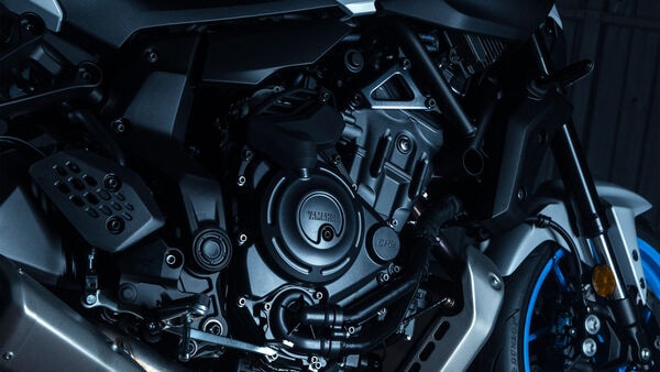 The 2025 Yamaha MT-07 is powered by the CP2 698 cc twin-cylinder liquid-cooled motor that gets an updated airbox and new intake tunnels. Ports atop the fuel tank channel intake noise for an improved exhaust note. 