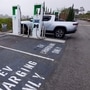 FILE PHOTO: Electric vehicle chargers from Electrify America are shown in a shopping center parking lot in Oceanside, California, U.S.,October 19, 2023.  REUTERS/Mike Blake/File Photo (REUTERS)