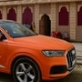 An Audi luxury spotted at Mahakumbh Mela finished in saffron colour scheme.