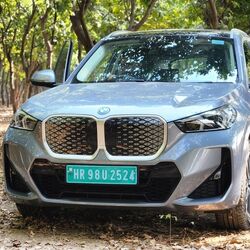 The BMW iX1 LWB Electric is priced at an introductory ₹49 lakhs before taxes, making it more affordable than the base X1 by ₹80,000. It is an identical twin of the iX1, featuring a large kidney grille, adaptive LED headlamps, and a stretched roofline.