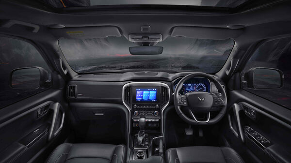 The interior of the Mahindra Scorpio N Carbon Edition is finished in an all-black theme with dark chrome accents.