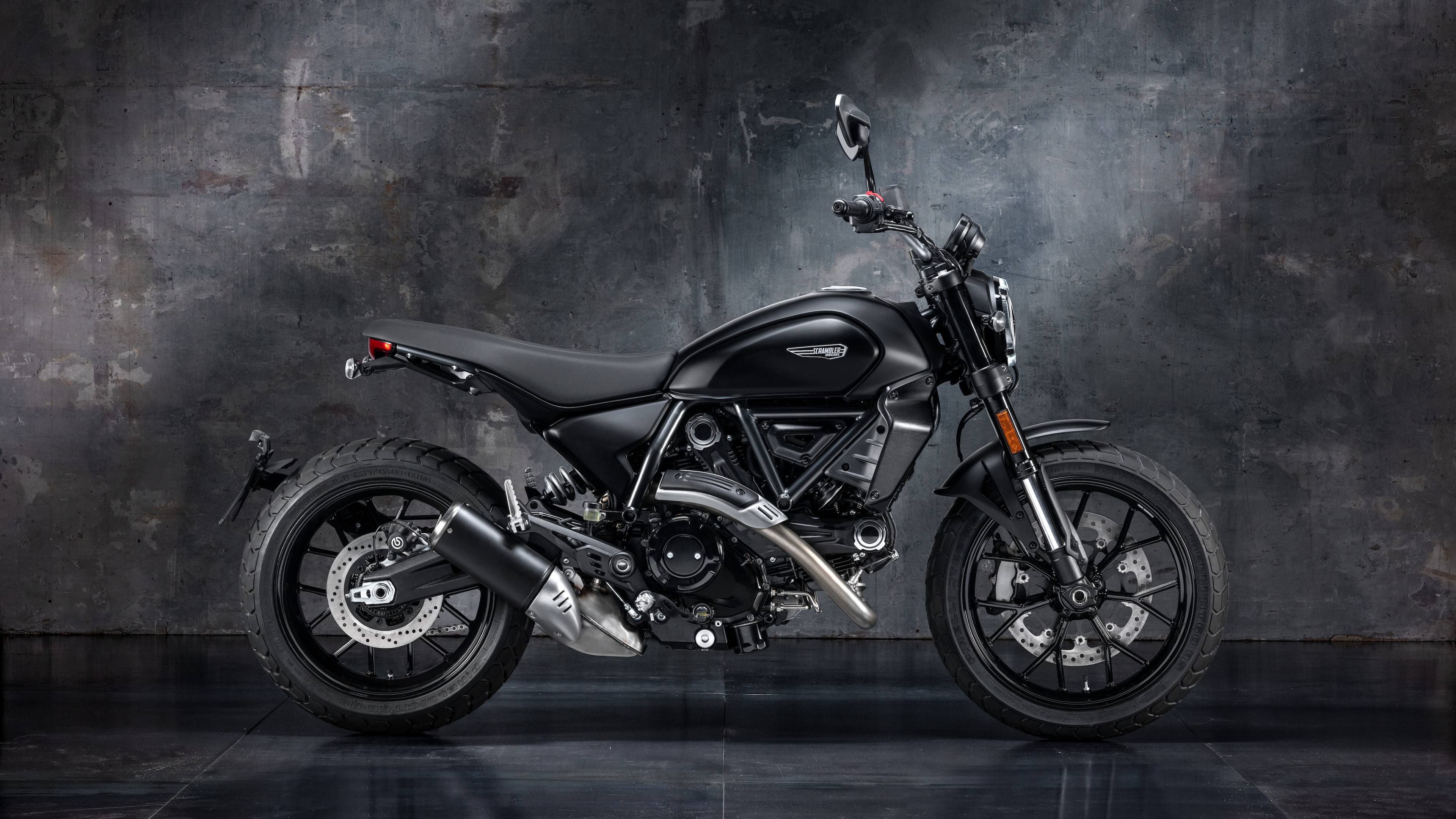The 2025 Ducati Scrambler Dark Icon gets a dark theme with the matte black paint scheme, while the engine, frame, mudguard, and even the tail section have been painted black 2025 Ducati Scrambler Dark Icon