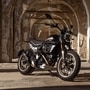 The 2025 Scrambler Full Throttle is distinguished by its aggressive black and bronze paint job that exudes flat track racing attitude.