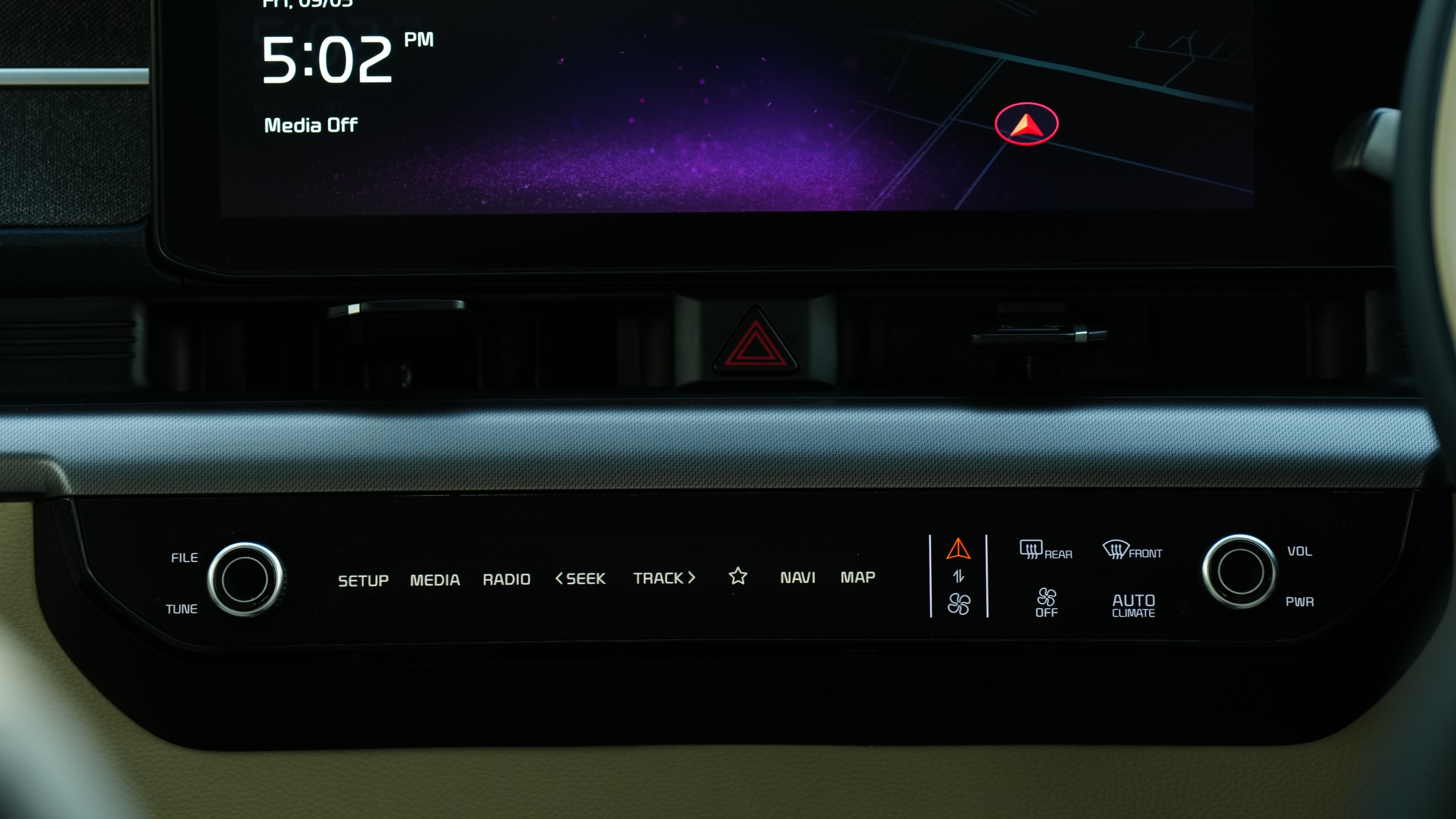 The switch panel lets you opt between the infotainment system and the HVAC unit Kia Carens Clavis Review