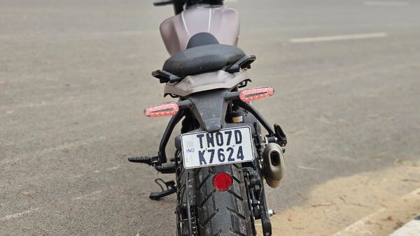 The tail lamp is the same unit as the Himalayan 450. The exhaust style is also shared between both motorcycles.
