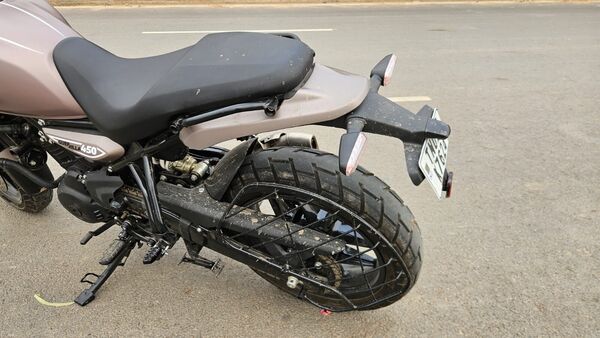 Because, there is no proper tyre hugger and mudguard, the tyre throws a lot of mud around the chain, tail section and even on the seat.