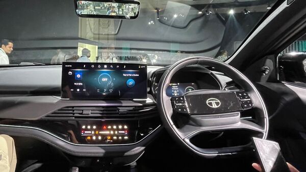 The interior of the Harrier EV is built with a host of collaborations. A 14.5-inch Harmann powered Samsung Neo QLED display sits right at the centre of the dashboard. This unit is connected to 10 JBL Black speakers capable of delivering Dolby Atmos audio. The interior of the Harrier EV is built with a host of collaborations. A 14.5-inch Harmann powered Samsung Neo QLED display sits right at the centre of the dashboard. This unit is connected to 10 JBL Black speakers capable of delivering Dolby Atmos audio.