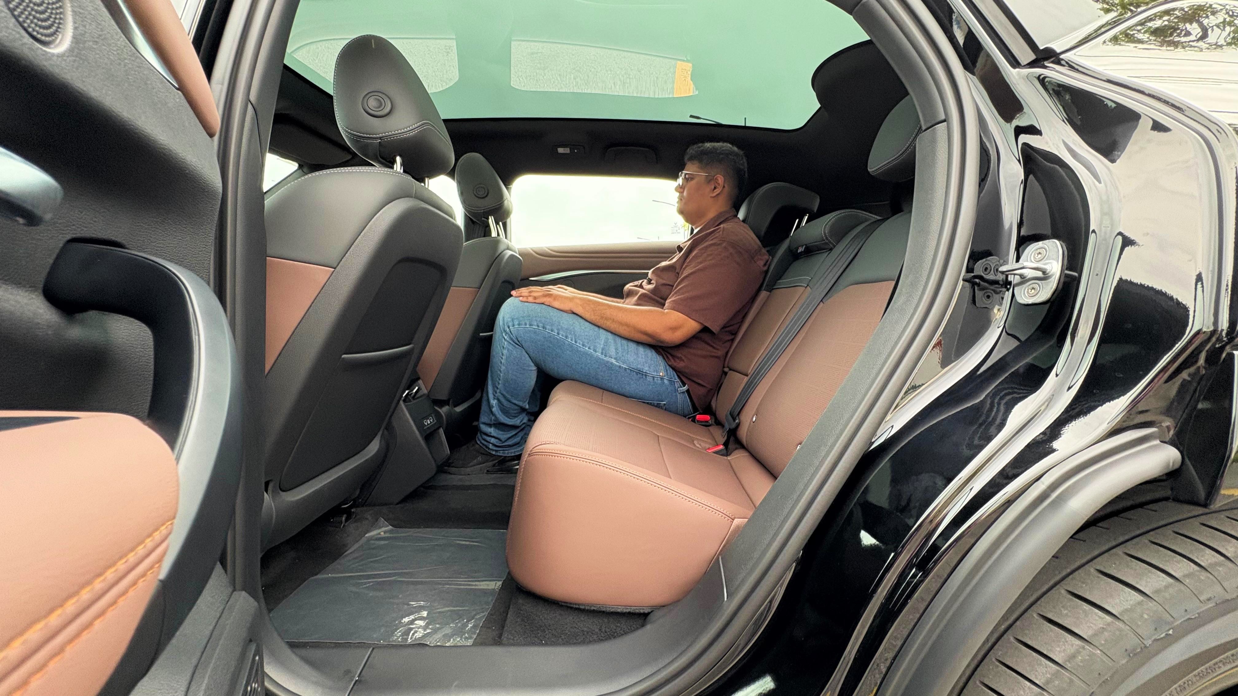 The rear seat is spacious with plenty of room for all three occupants on the VF7. The fixed glass roof adds to the roomy feel, while the seats come with a reclining function further making it a comfortable experience VinFast VF7 Review