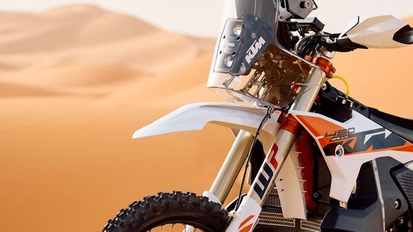 There is a bash plate, knobby tyres and three fuel tanks.