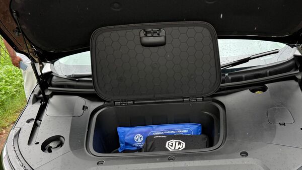 There is a small storage space in the front which can easily accommodate the portable charger, warning triangle etc.