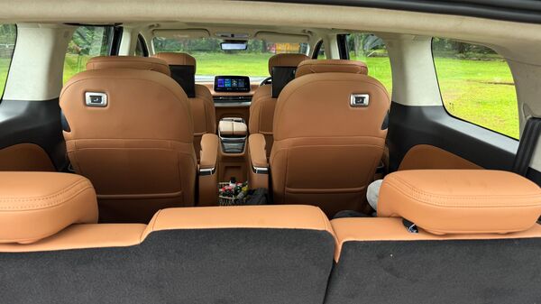 The third row occupants get a button to reset the position of the second row seats in case they don't have enough space to get out.
