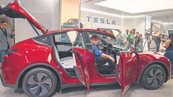Tesla will initially sell only the Model Y crossover as a CBU model in India, while at a later stage, the OEM may bring more models and even start local manufacturing of its cars as well. (Photo by Satish Bate/ Hindustan Times) (Hindustan Times) Tesla
