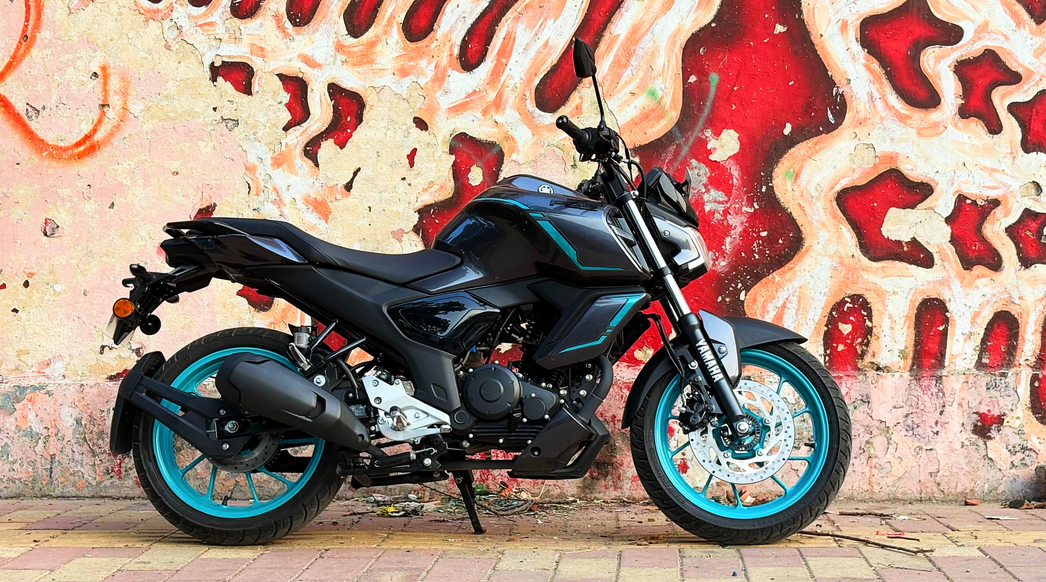 The Yamaha FZS Hybrid gets the same design as the standard FZS, save for the new indicators integrated into the fuel tank shrouds and revised body graphics 2025 Yamaha FZS Hybrid Review
