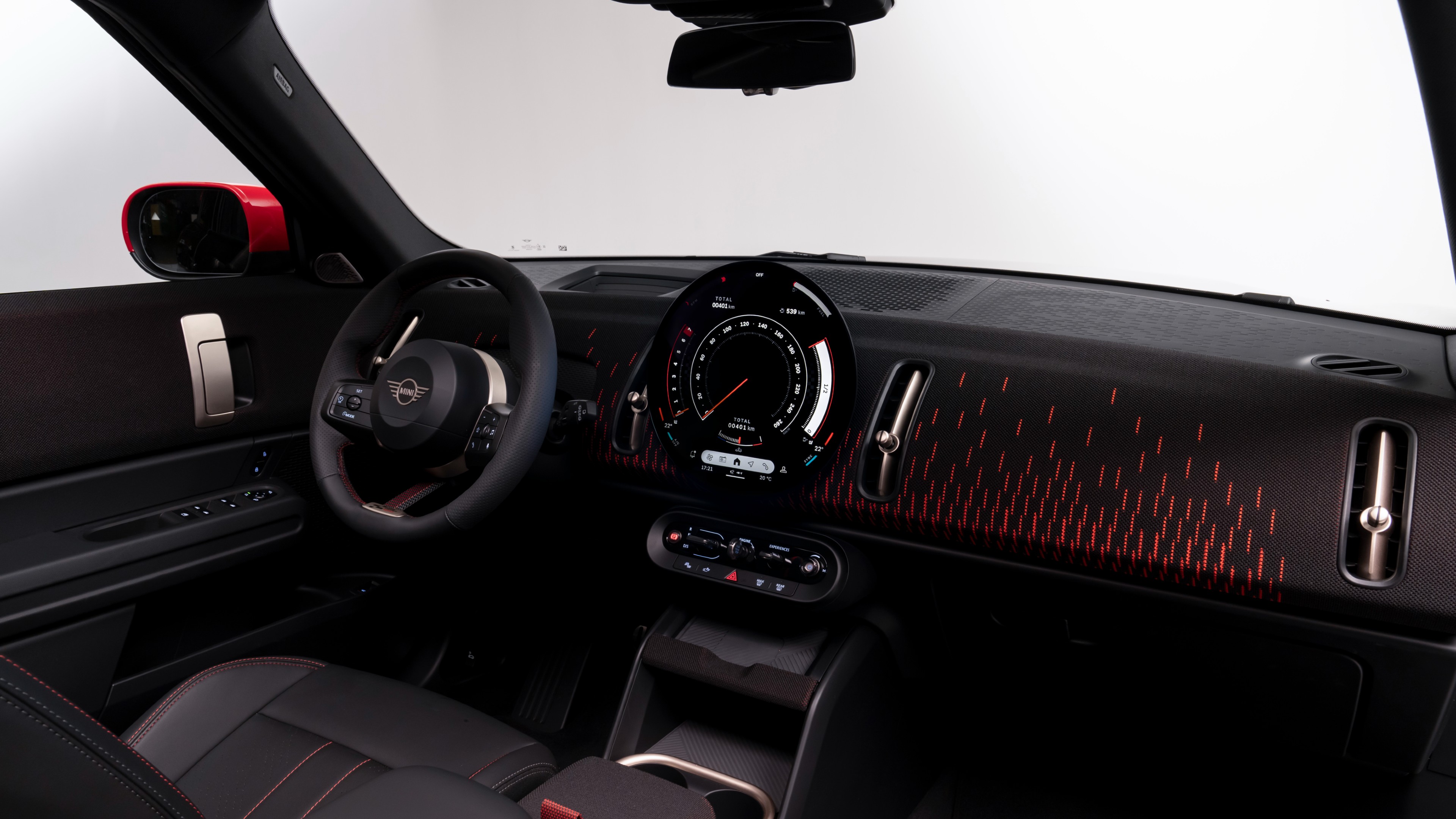 The cabin gets the all-black treatment as well with contrast red accents on the dashboard and seats, as well as JCW-specific graphics MINI Countryman JCW