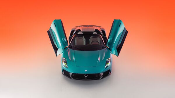 Maserati has included flamboyant butterfly wing doors in the MCPura, alongside a retractable glass roof for the convertible Maserati MCPura
