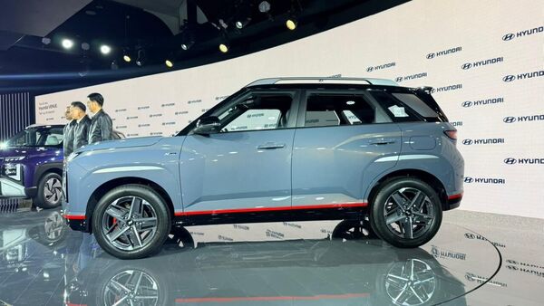 The 2025 Venue N-Line puts on distinctive cosmetic elements, including a dark chrome grille, unique bumpers and red accents all around 2025 Hyundai Venue N-Line