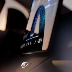 The Volvo EX60’s cabin features a large floating touchscreen and a minimalist dashboard layout with limited physical controls